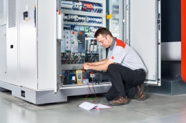 Technician repairing a laser machine