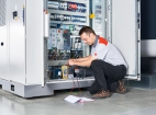 Technician repairing a laser machine
